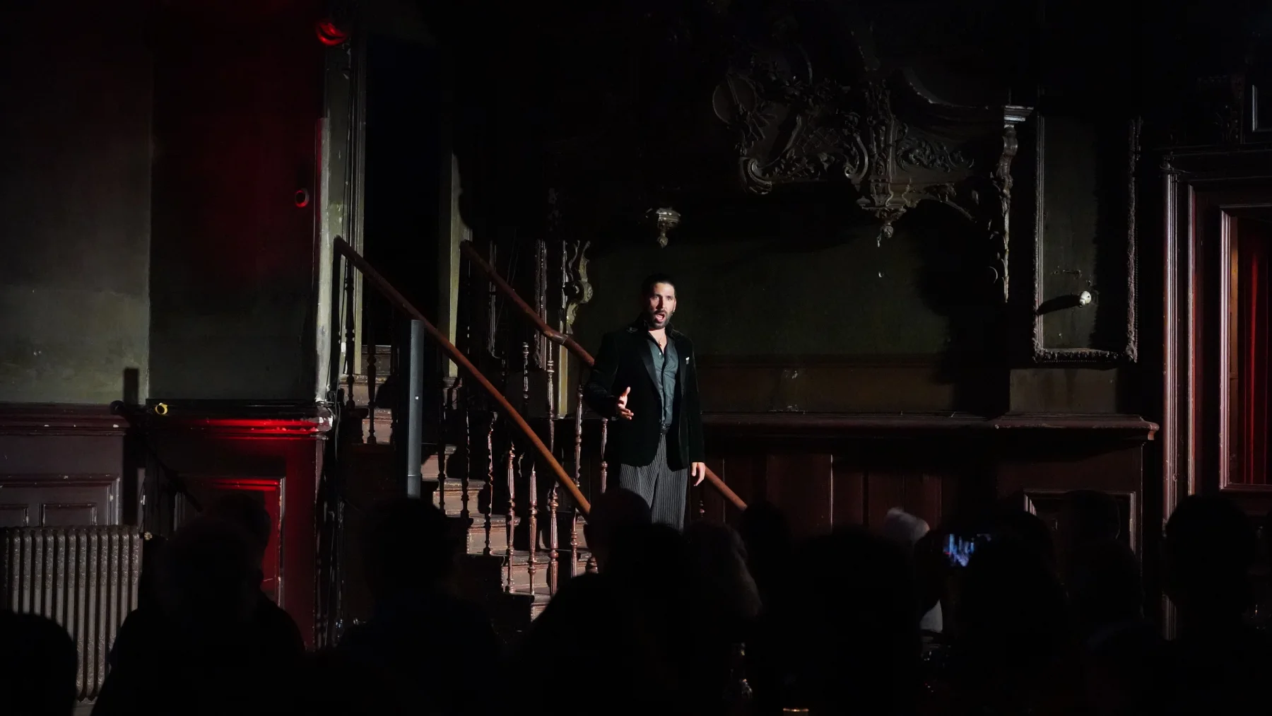 Rolando Guy performing on the staircase at Clärchens Ballhaus